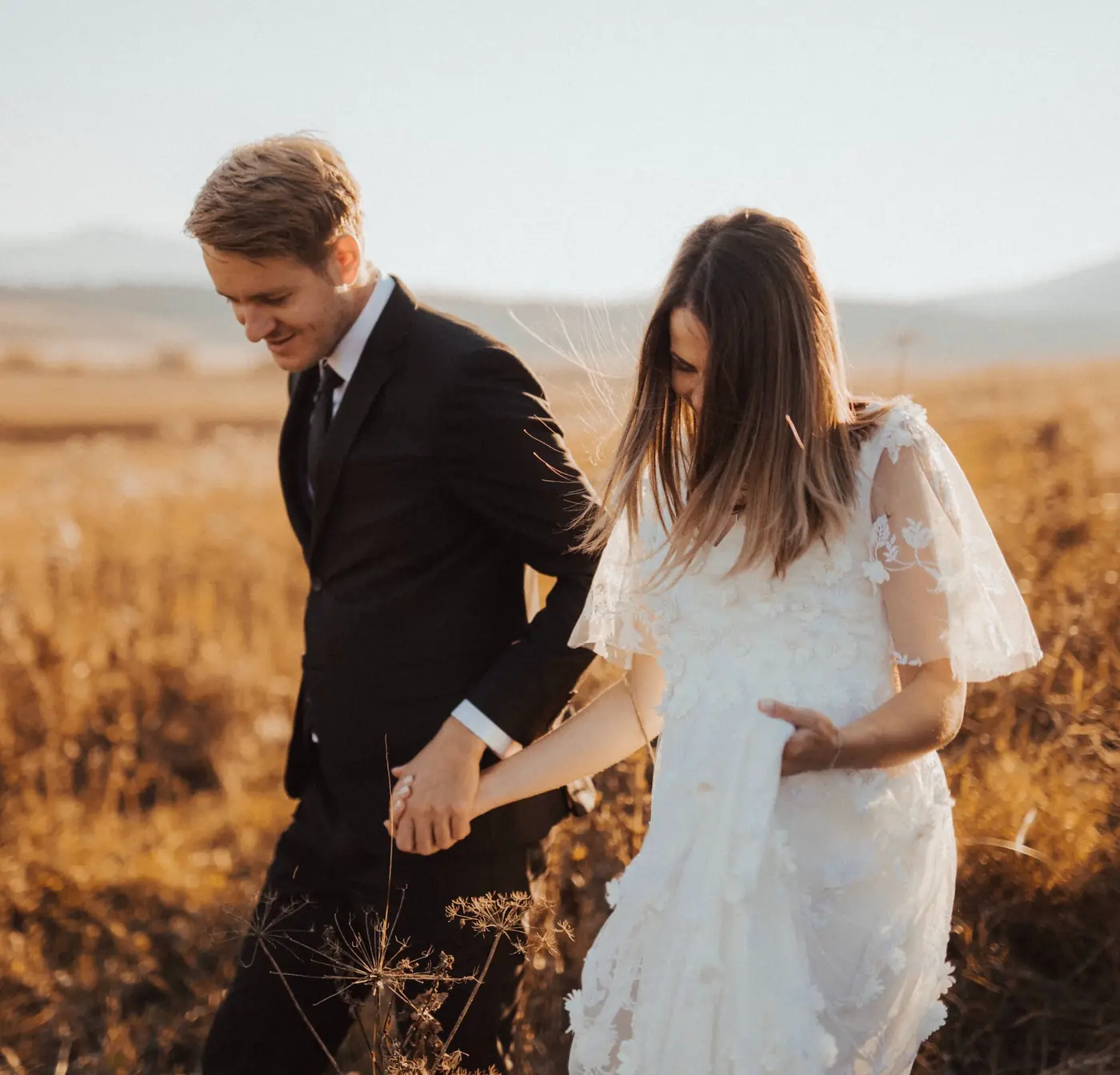 Wedding video packages — bride and groom walking
